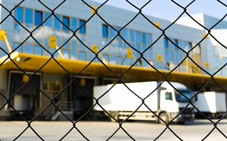 White truck parked inside the fence